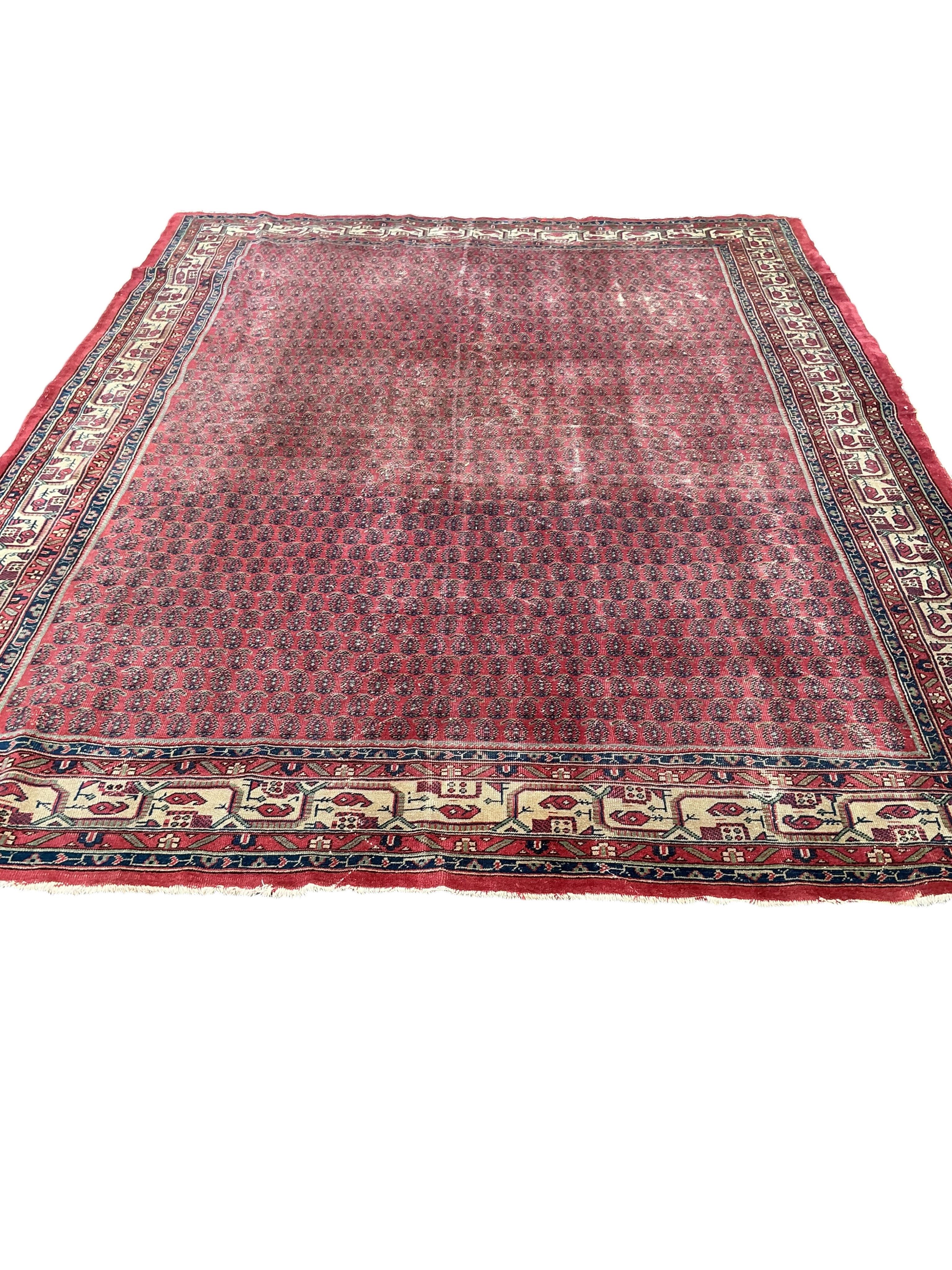 A North West Persian brick red ground Boteh carpet, 355 x 265cm